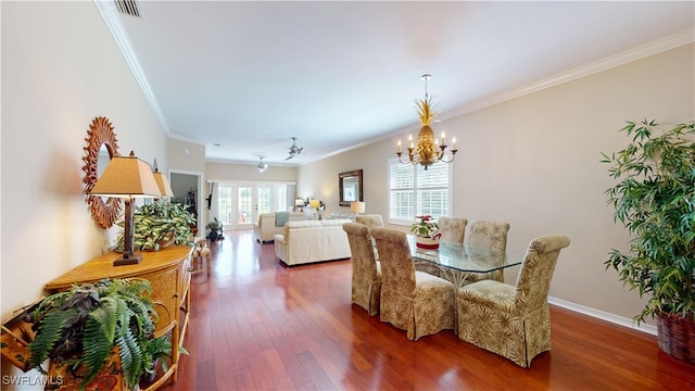 dining area with baseboards, ornamental molding, dark wood finished floors, and a notable chandelier