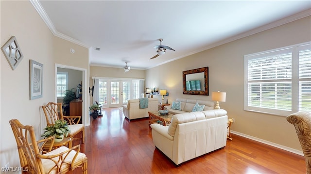 living room with baseboards, ceiling fan, ornamental molding, wood finished floors, and french doors