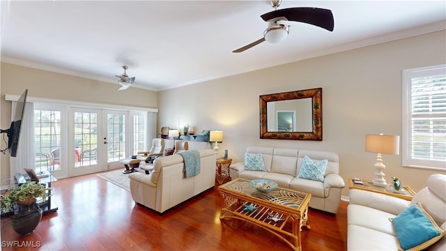 living room featuring french doors, wood finished floors, a ceiling fan, and crown molding