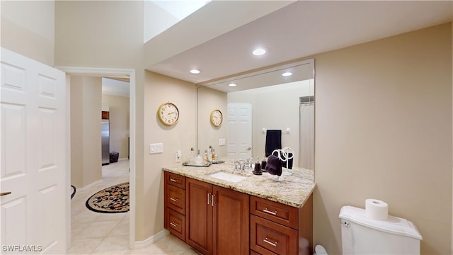 bathroom featuring toilet, tile patterned floors, vanity, and recessed lighting