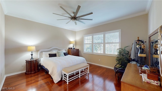 bedroom with dark wood-style floors, ornamental molding, and baseboards