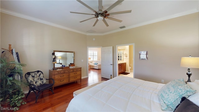 bedroom with dark wood-style floors, crown molding, visible vents, a ceiling fan, and connected bathroom