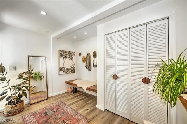 interior space with light wood-type flooring, baseboards, and recessed lighting