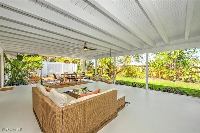 view of patio featuring a ceiling fan, outdoor dining space, and a fenced backyard