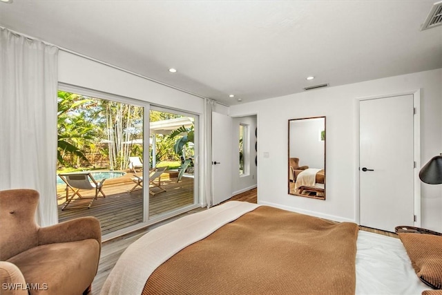 bedroom with access to outside, visible vents, and recessed lighting