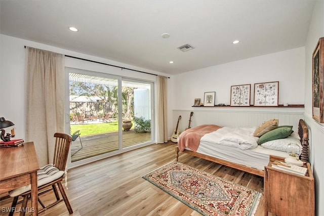 bedroom featuring access to exterior, visible vents, wood finished floors, and recessed lighting