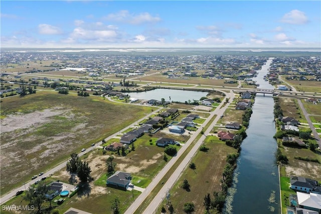 aerial view featuring a residential view and a water view