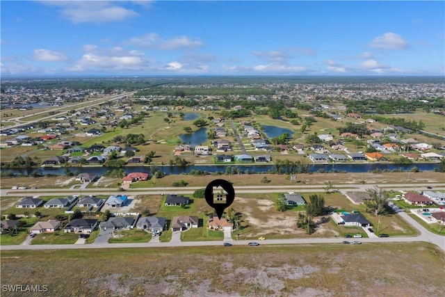 aerial view featuring a water view and a residential view