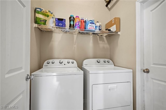 washroom with laundry area and washing machine and dryer