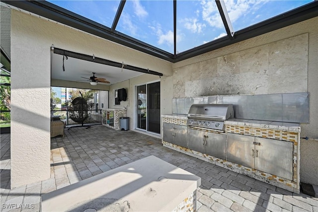 view of patio / terrace featuring a ceiling fan and area for grilling