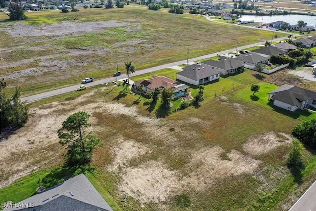 aerial view featuring a residential view and a water view