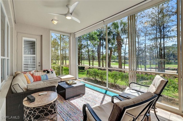 sunroom featuring a ceiling fan