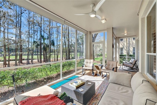 sunroom / solarium with ceiling fan