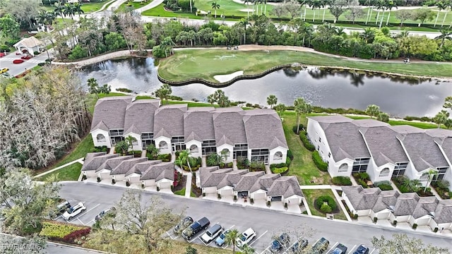 birds eye view of property featuring a water view and a residential view