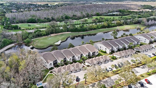 bird's eye view featuring view of golf course, a water view, and a residential view