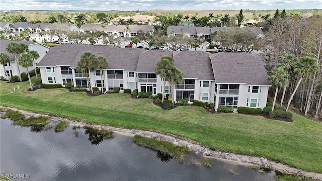 aerial view with a water view and a residential view