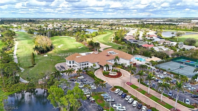 aerial view with view of golf course and a water view