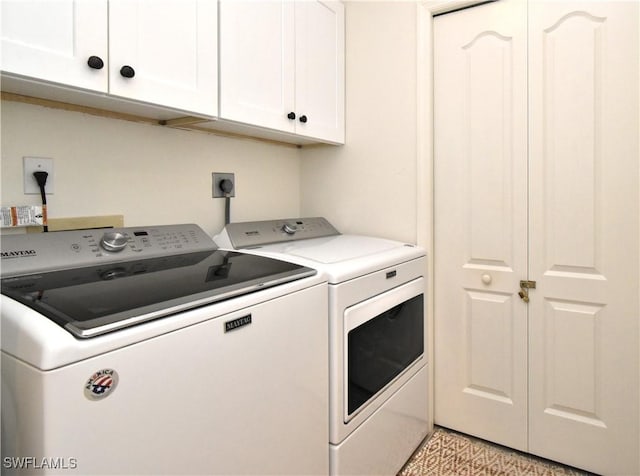 laundry area with cabinet space and washer and dryer