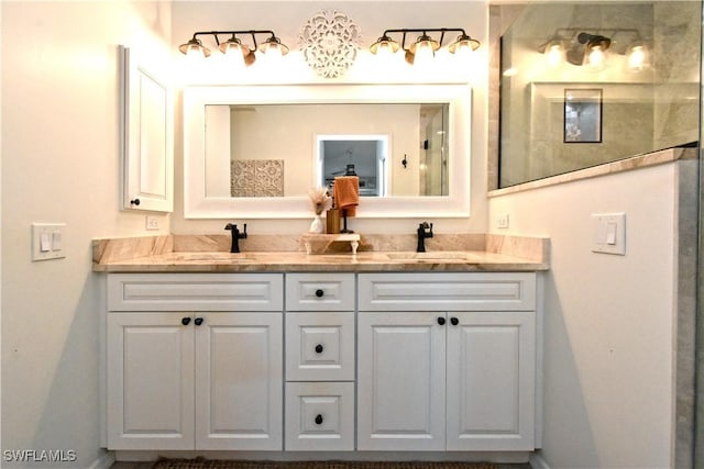 full bathroom featuring double vanity and a sink