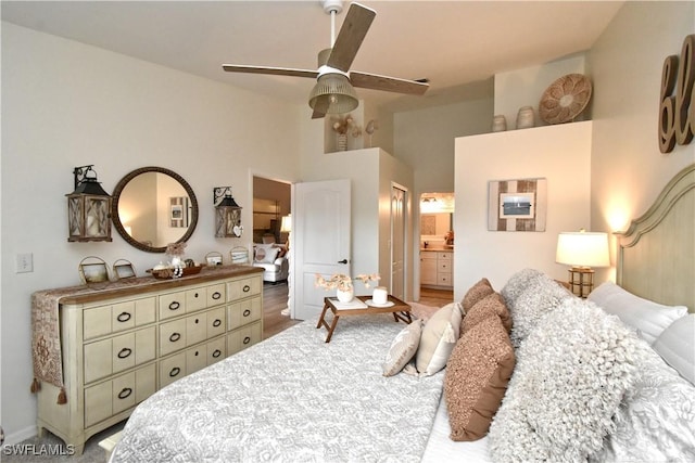 bedroom featuring high vaulted ceiling, connected bathroom, and a ceiling fan