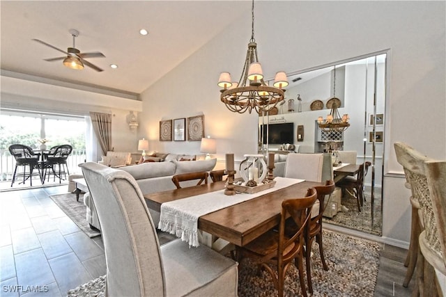 dining area featuring high vaulted ceiling, recessed lighting, and ceiling fan with notable chandelier