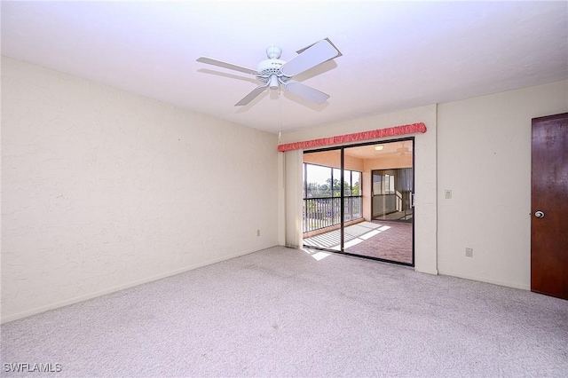 unfurnished room with carpet floors, ceiling fan, and baseboards