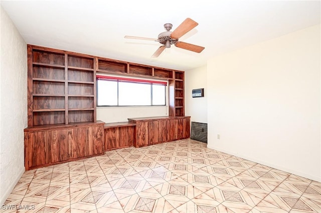 spare room featuring a ceiling fan and light floors