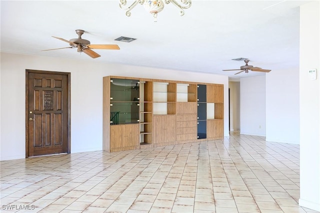 unfurnished room with light tile patterned floors, visible vents, and a ceiling fan