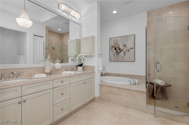 full bathroom with a garden tub, a stall shower, a sink, and tile patterned floors