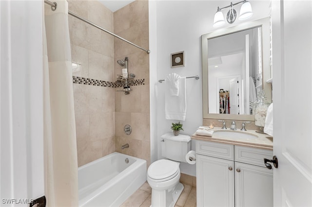 full bath with toilet, tile patterned floors, vanity, and shower / bathtub combination