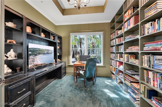 home office with a chandelier, baseboards, a tray ceiling, carpet, and crown molding