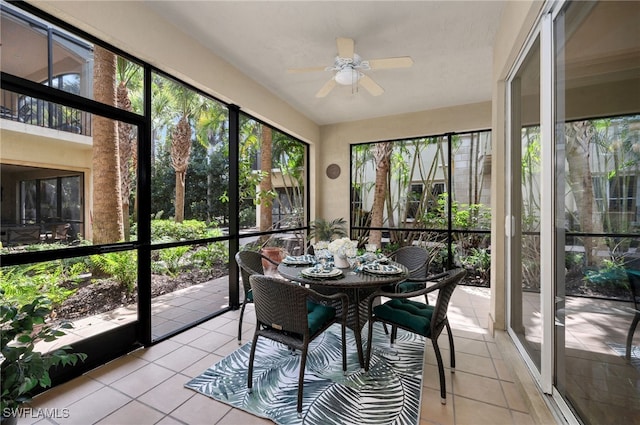 sunroom featuring a ceiling fan