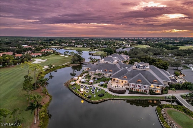 aerial view at dusk with a water view