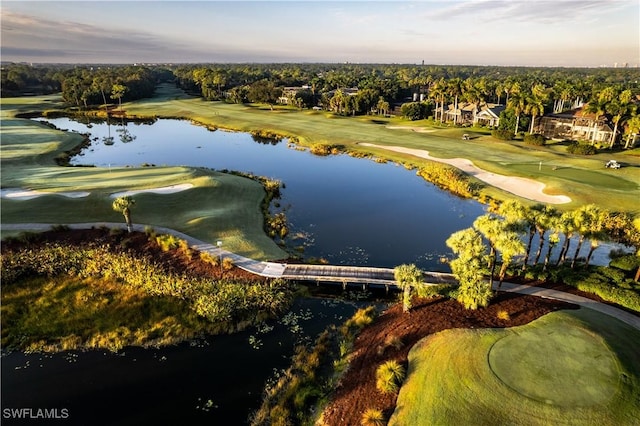 aerial view with view of golf course and a water view