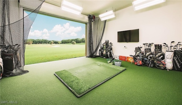 rec room with golf simulator and carpet