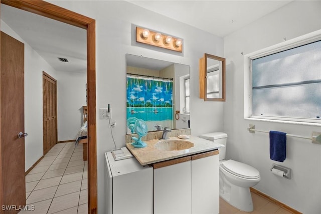 full bath with visible vents, toilet, vanity, baseboards, and tile patterned floors