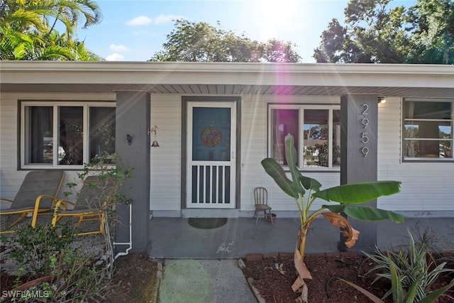 entrance to property with a porch