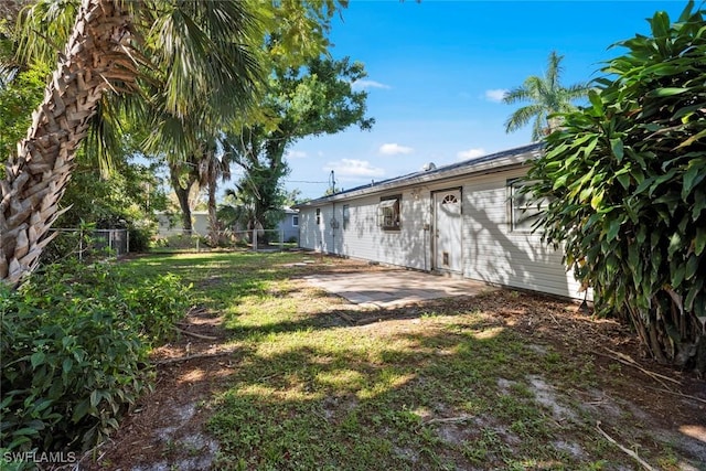 view of yard featuring a patio area and fence