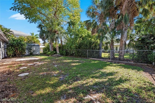 view of yard with a fenced backyard