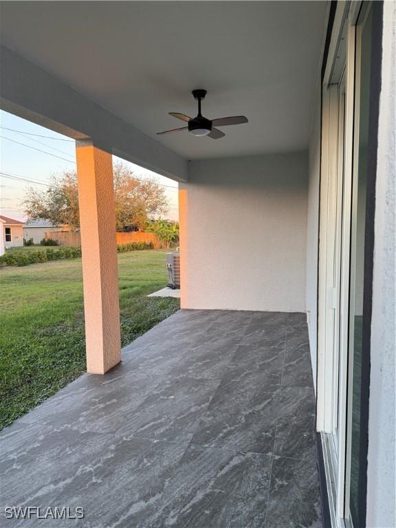 view of patio with ceiling fan, fence, and central air condition unit