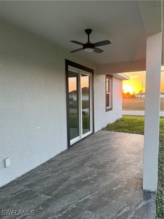 view of patio featuring a ceiling fan