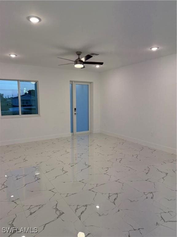 empty room featuring marble finish floor, ceiling fan, baseboards, and recessed lighting