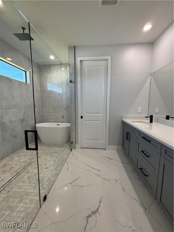 full bath with recessed lighting, vanity, marble finish floor, a soaking tub, and a marble finish shower