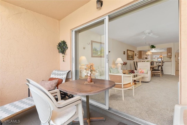 interior space with ceiling fan and outdoor dining space