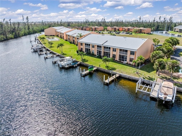 birds eye view of property with a water view and a residential view