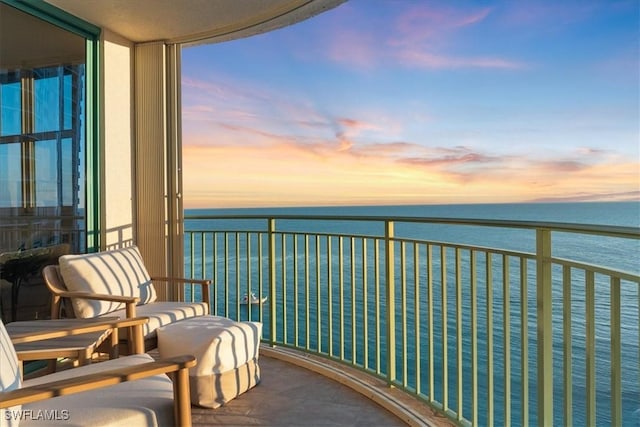 balcony at dusk with a water view