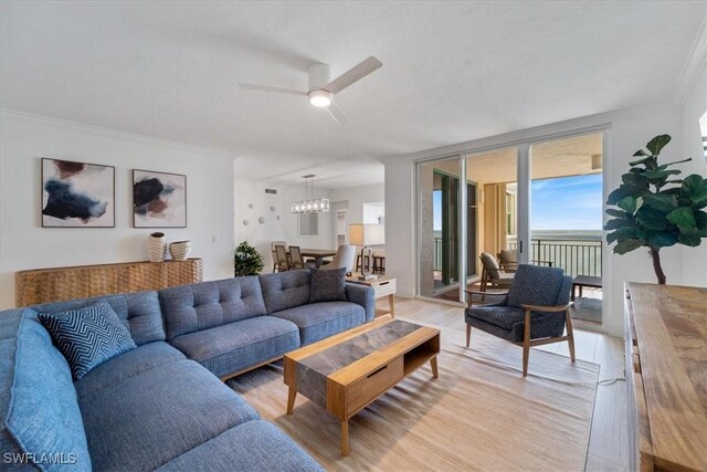 980 Cape Marco Dr Unit 805, Marco Island, FL 34145 - living area featuring light wood-style flooring, ornamental molding, a ceiling fan, and a chandelier