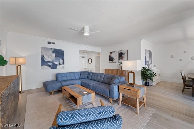 980 Cape Marco Dr Unit 805, Marco Island, FL 34145 - living room featuring ceiling fan, crown molding, and light wood-style flooring