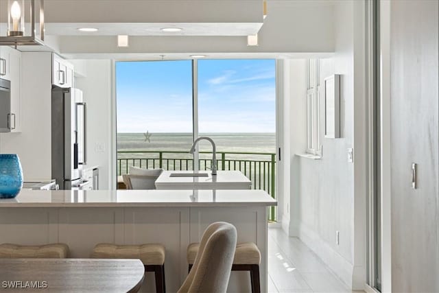 980 Cape Marco Dr Unit 805, Marco Island, FL 34145 - dining room with a water view and light tile patterned floors