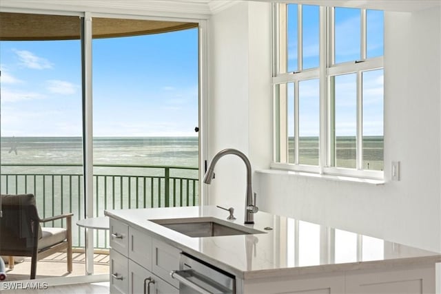 980 Cape Marco Dr Unit 805, Marco Island, FL 34145 - kitchen featuring a sink, a water view, dishwasher, ornamental molding, and light stone countertops
